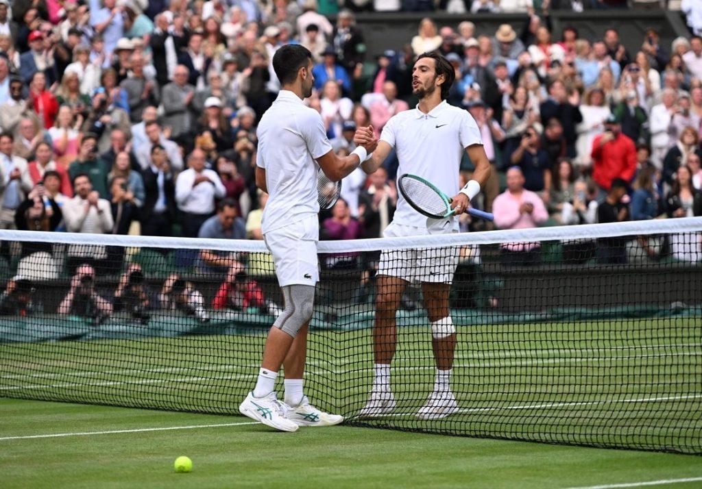 Novak Đoković i Lorenzo Musetti / Foto: Anadolu